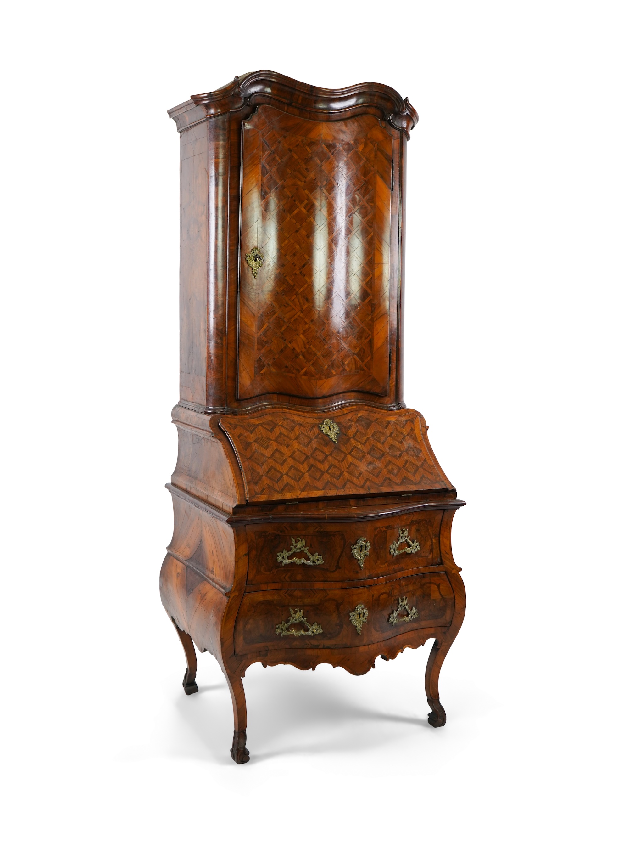 A mid 18th century North Italian or Maltese walnut and olive wood gilt metal mounted serpentine bureau cabinet